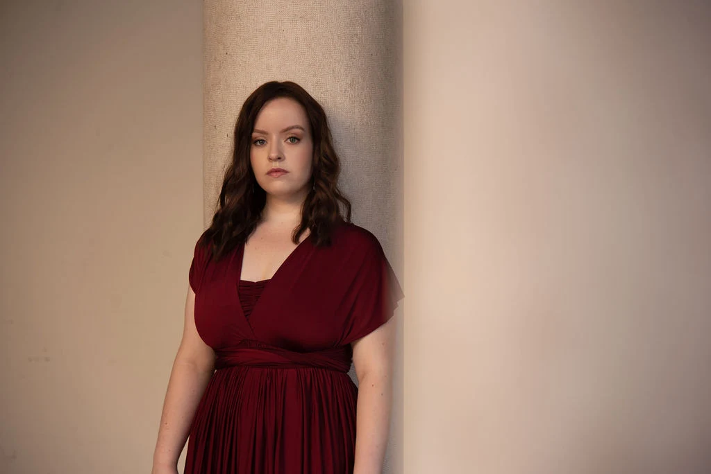 Donata Meyer-Kranixfeld in a burgundy concert dress